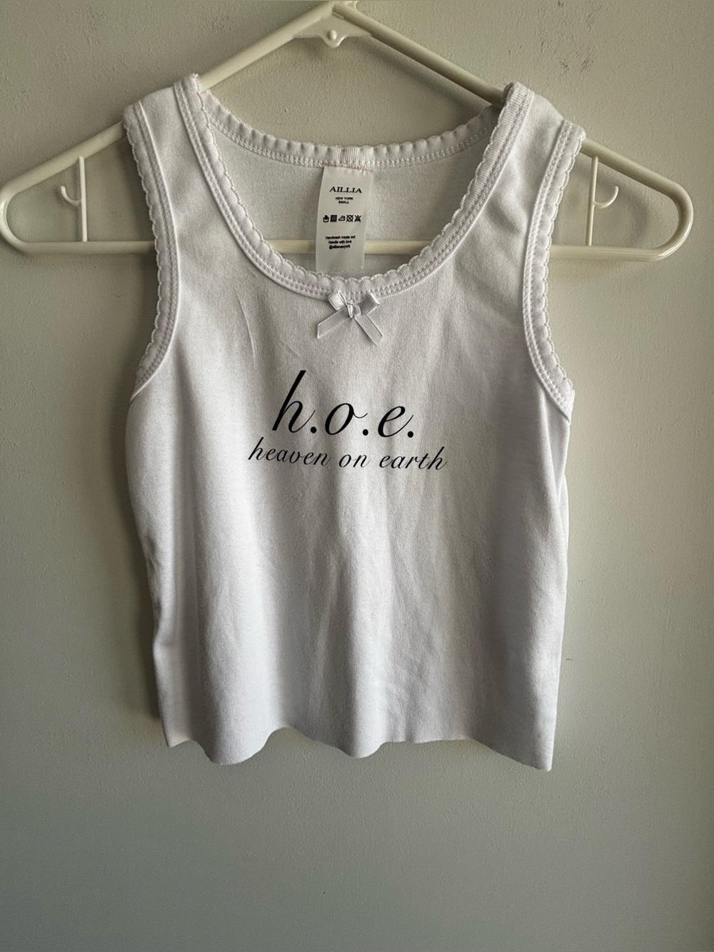 White Sleeveless Tank Top with 'h.o.e. heaven on earth' Script